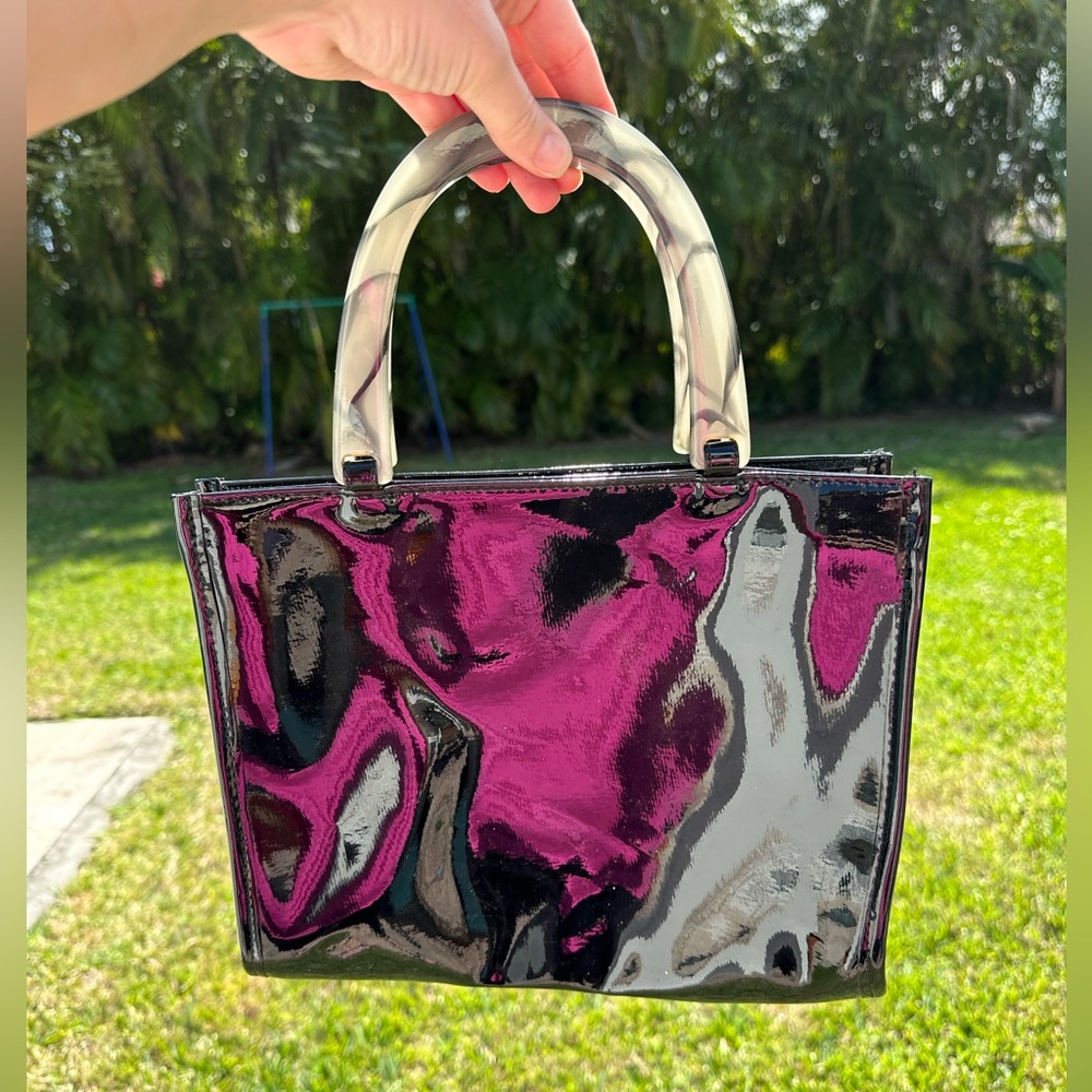 Neiman Marcus
Patent Marbled Top
Handle Black Tote